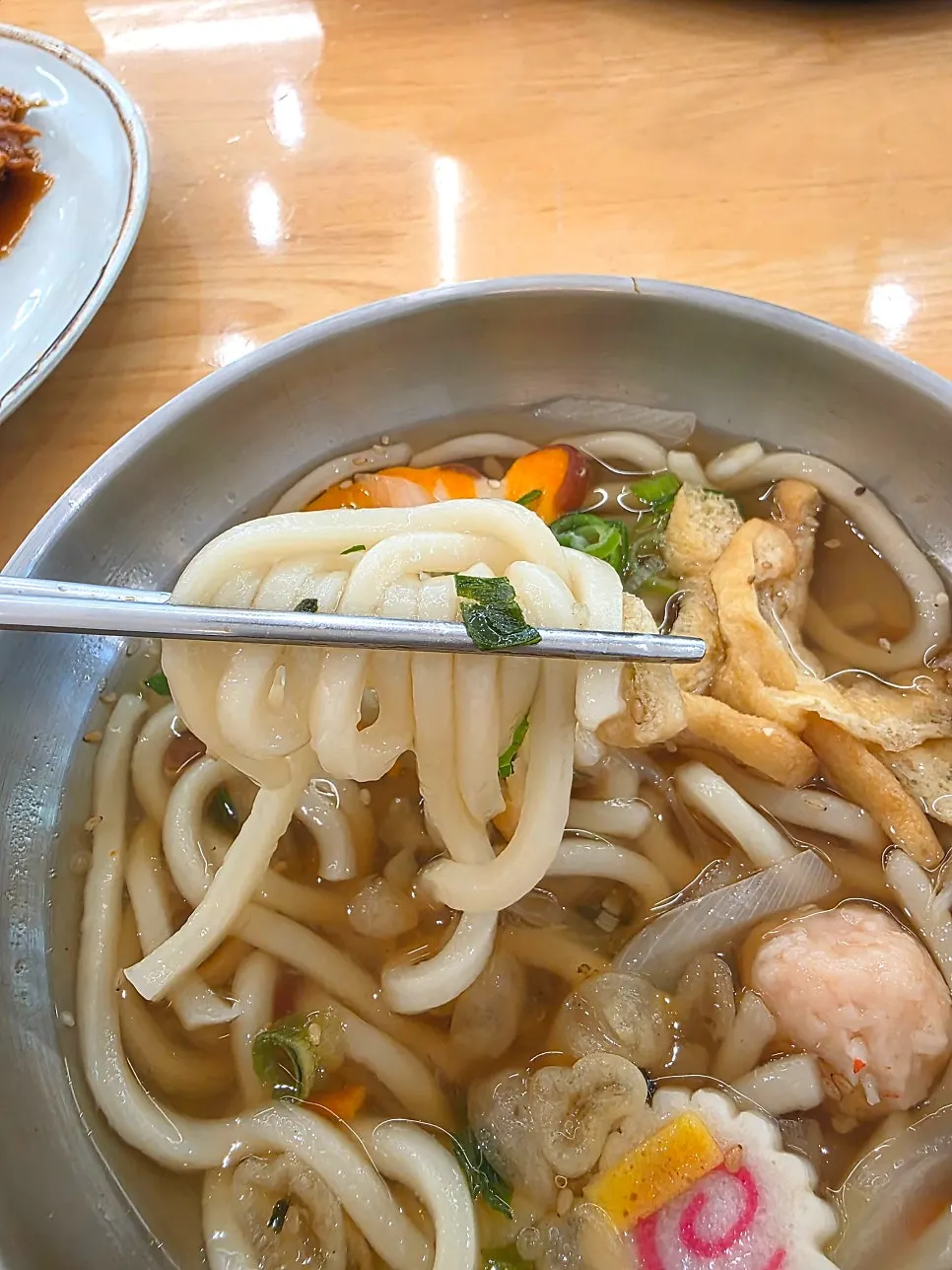 A bowl of udon served with the set