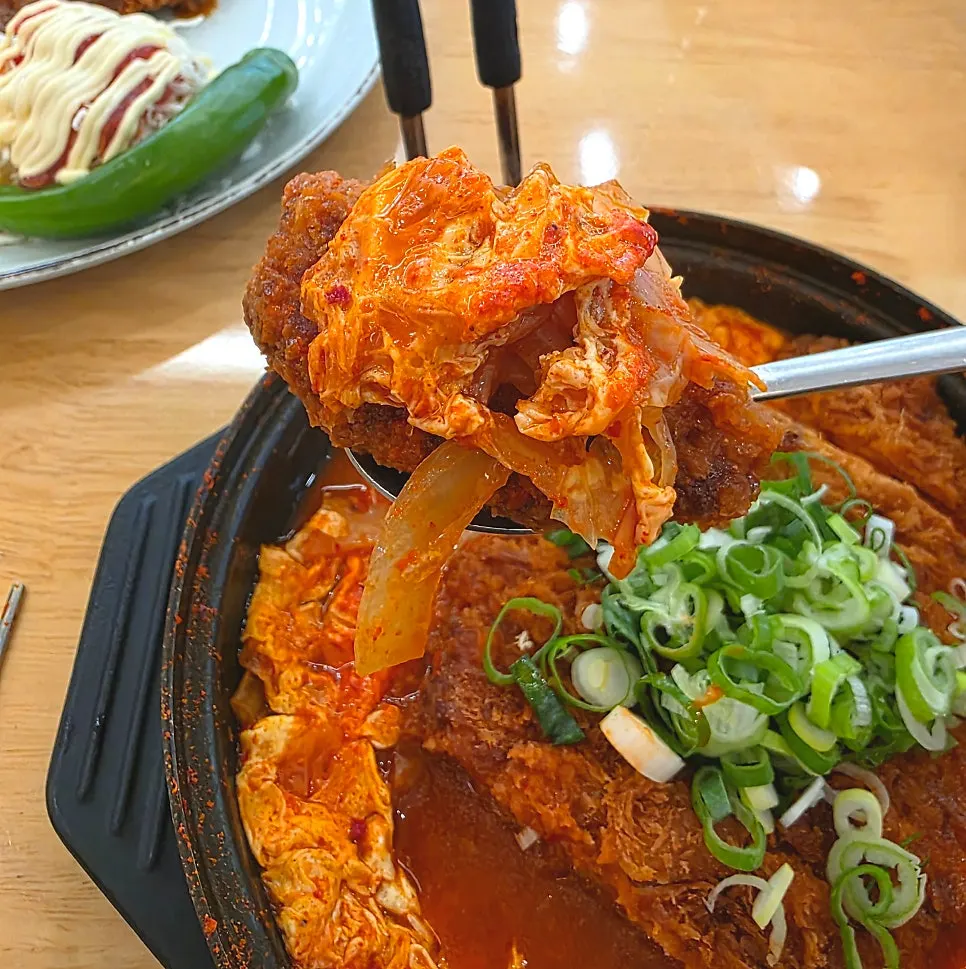 Spicy kimchi and egg mixed into the nabe