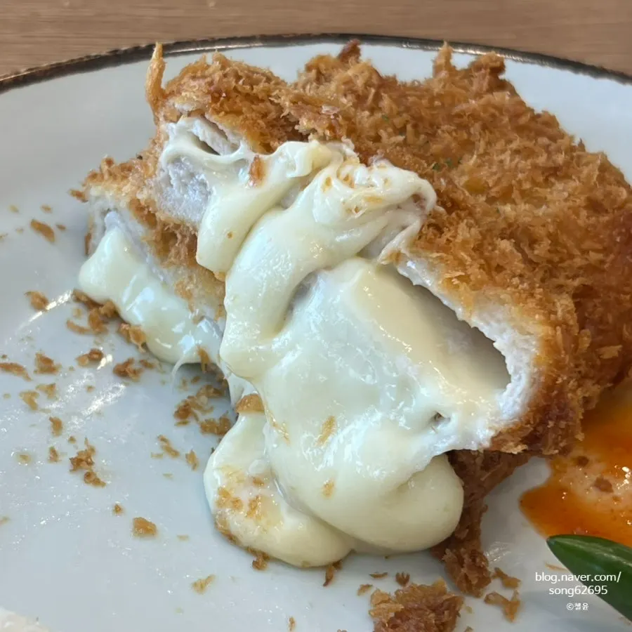 Cross-section of the cutlet with cheese gushing out
