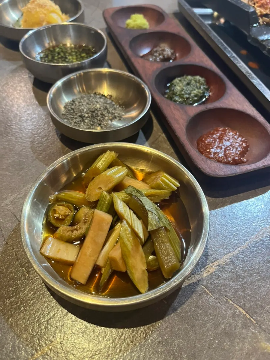A plate combining meat and side dishes