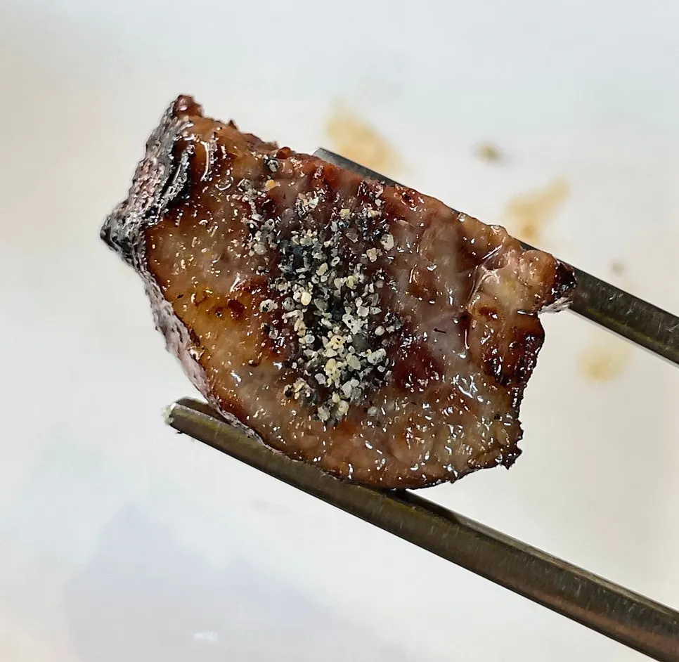 A fully cooked piece of woo-dae galbi