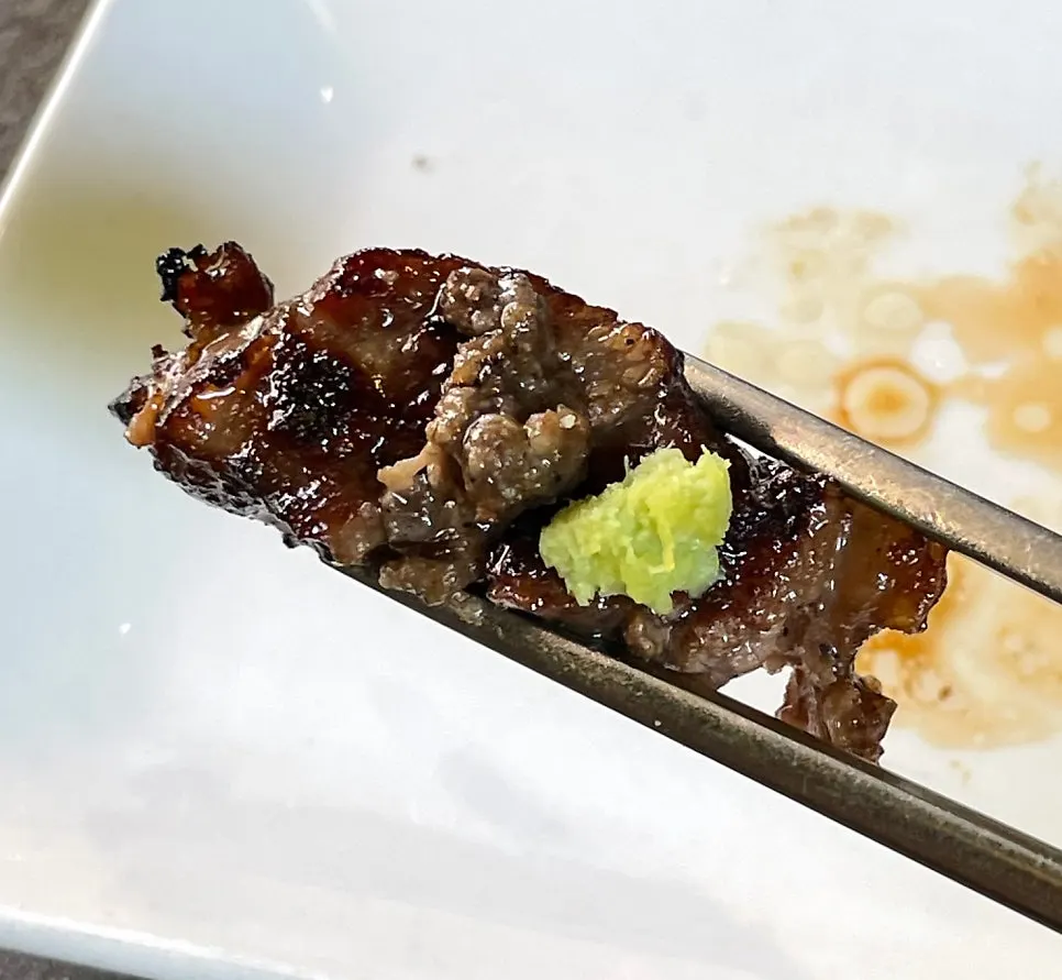Plate of sauces including black sesame salt and special soy sauce