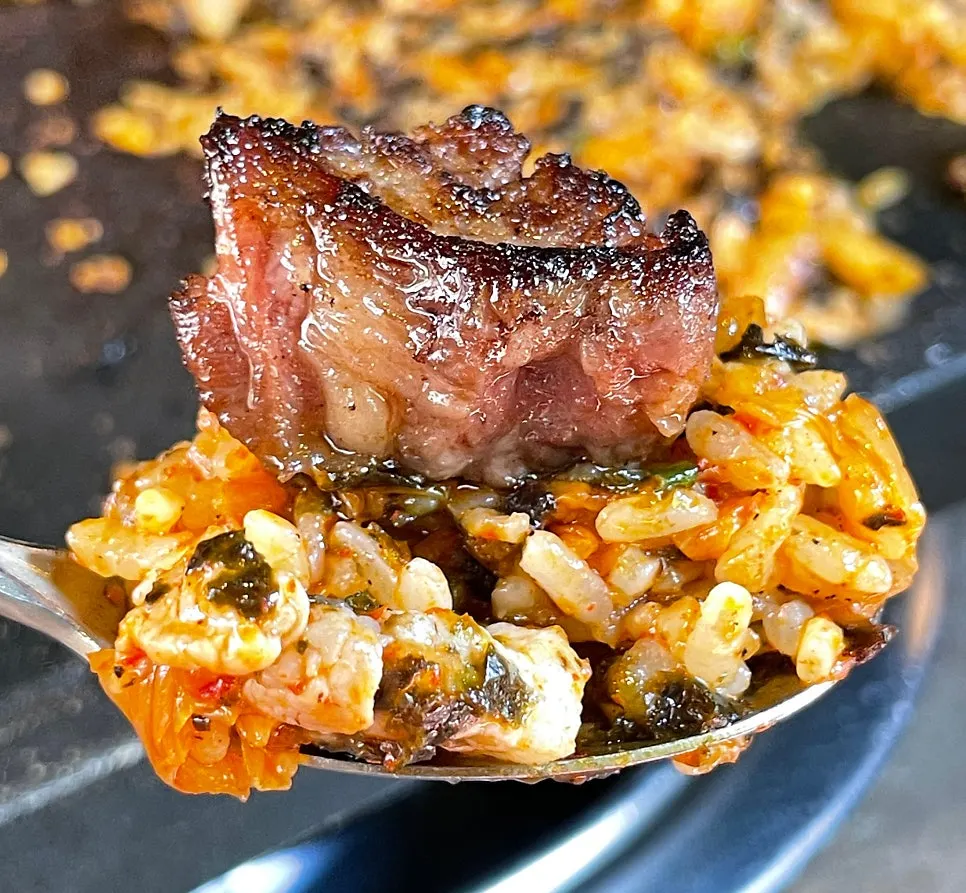 Woo-dae galbi placed on top of the fried rice