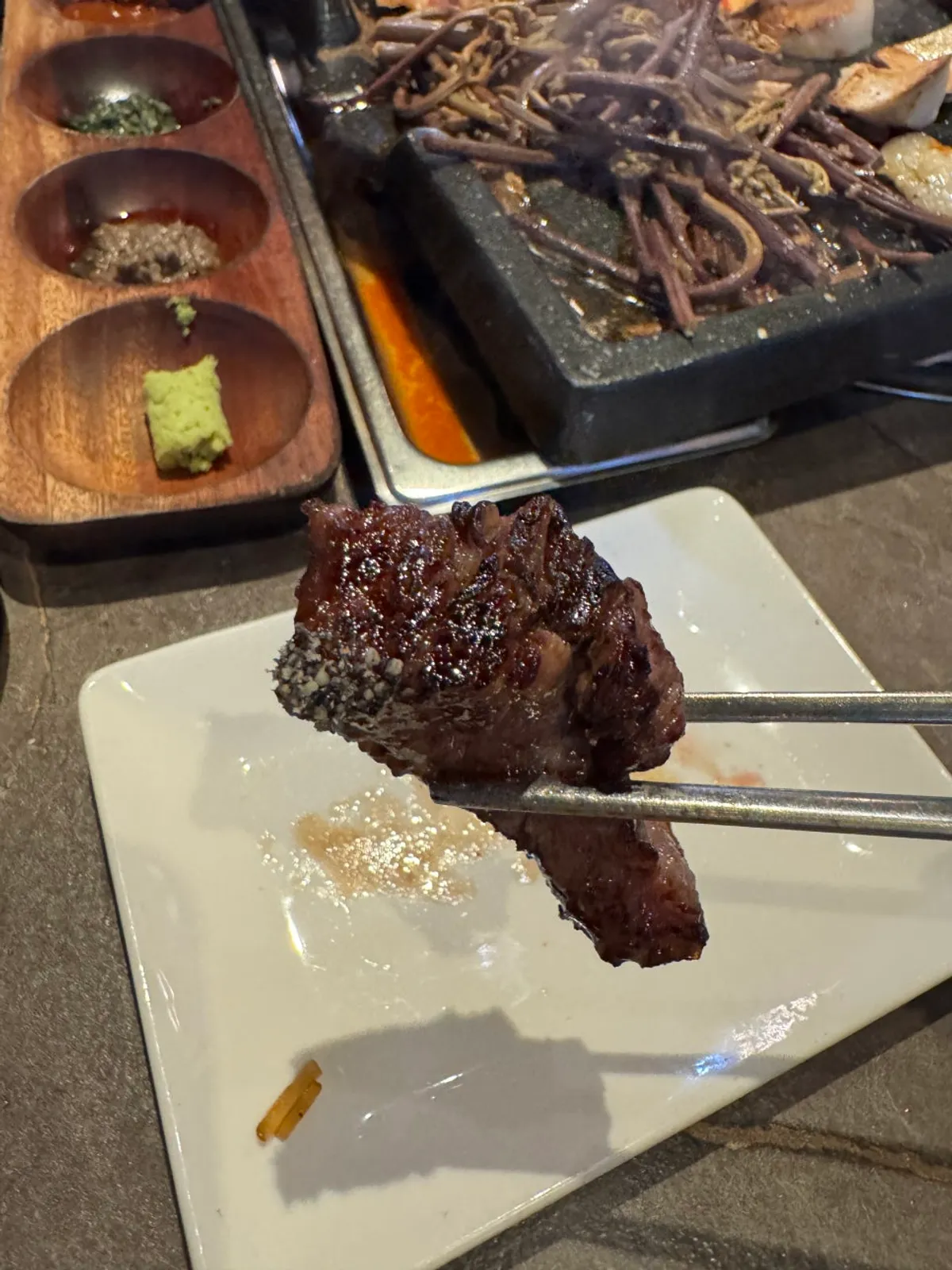 Marinated beef rib dipped in black sesame salt