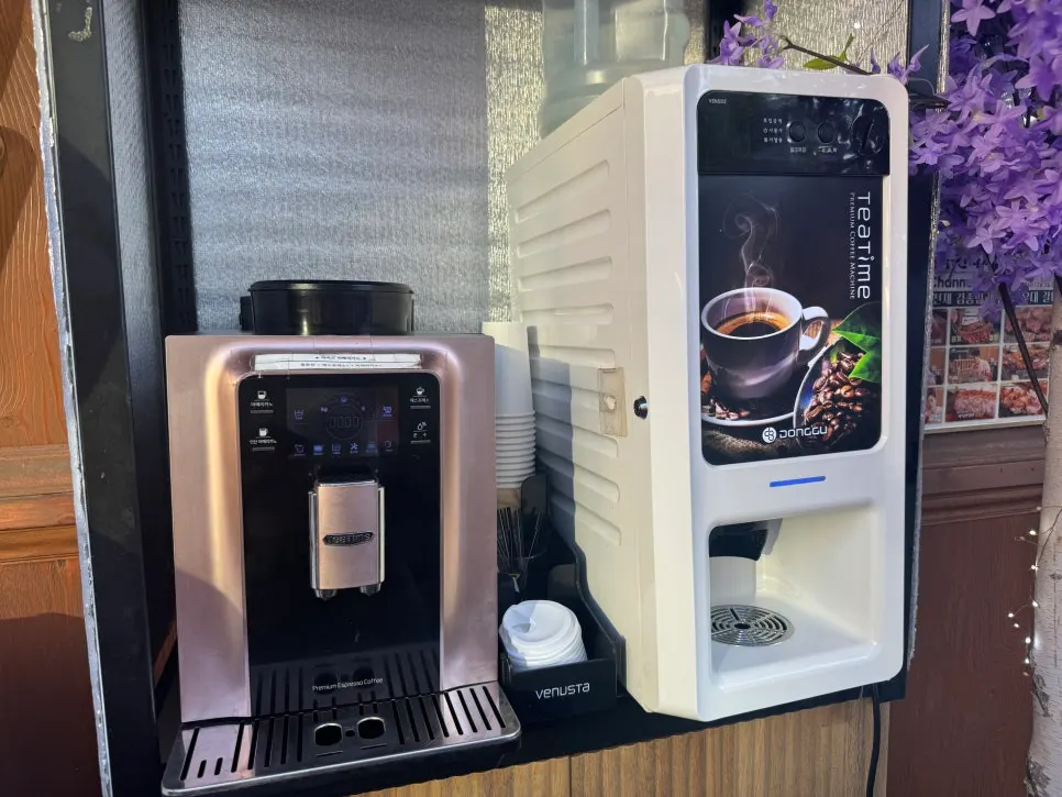 Two coffee machines at the restaurant entrance