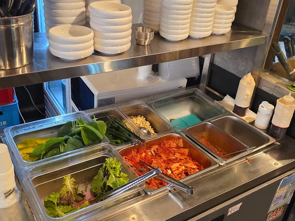 Self-serve corner with ssam wraps, garlic, and oil-salt