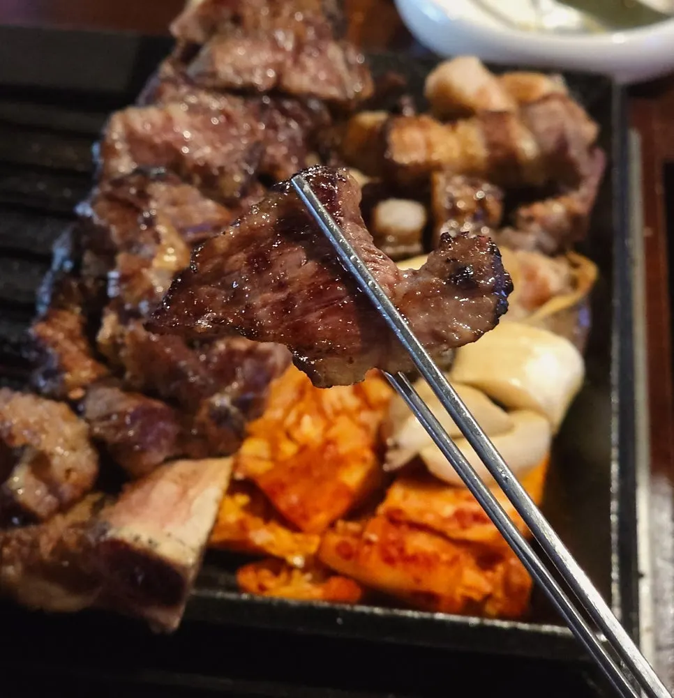 Grilled prime rib placed atop the rib bone