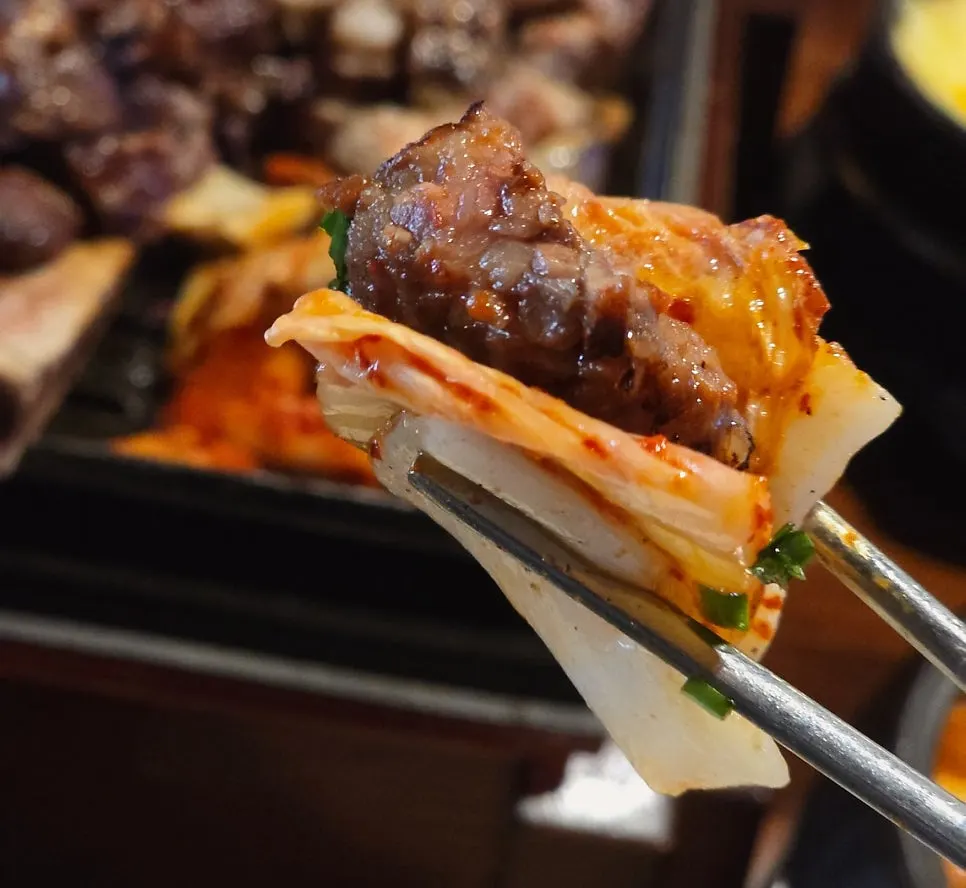 A piece of prime rib dipped in sigan-jang