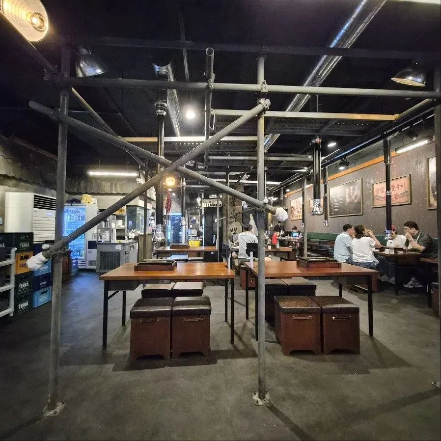 Spacious interior with construction-site concept design
