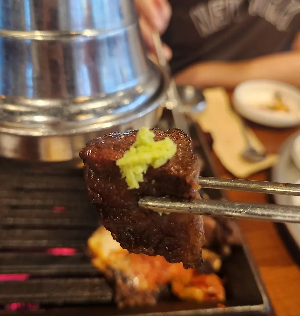 A piece of prime rib topped with sauce