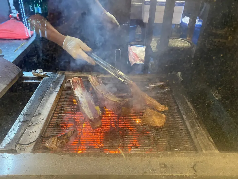 Pre-searing area at Jipbul Taebaek where meat is seared over rice straw