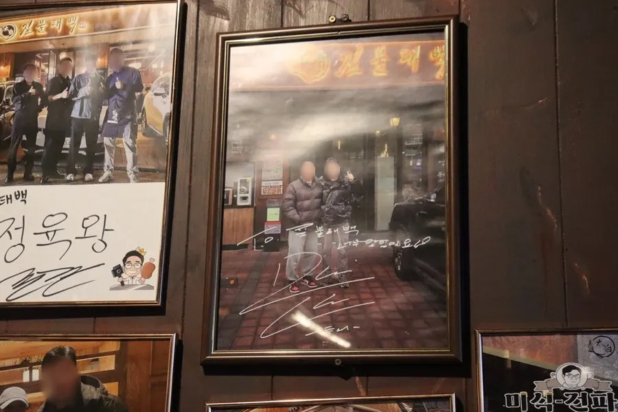Celebrity autographs hanging on the wall