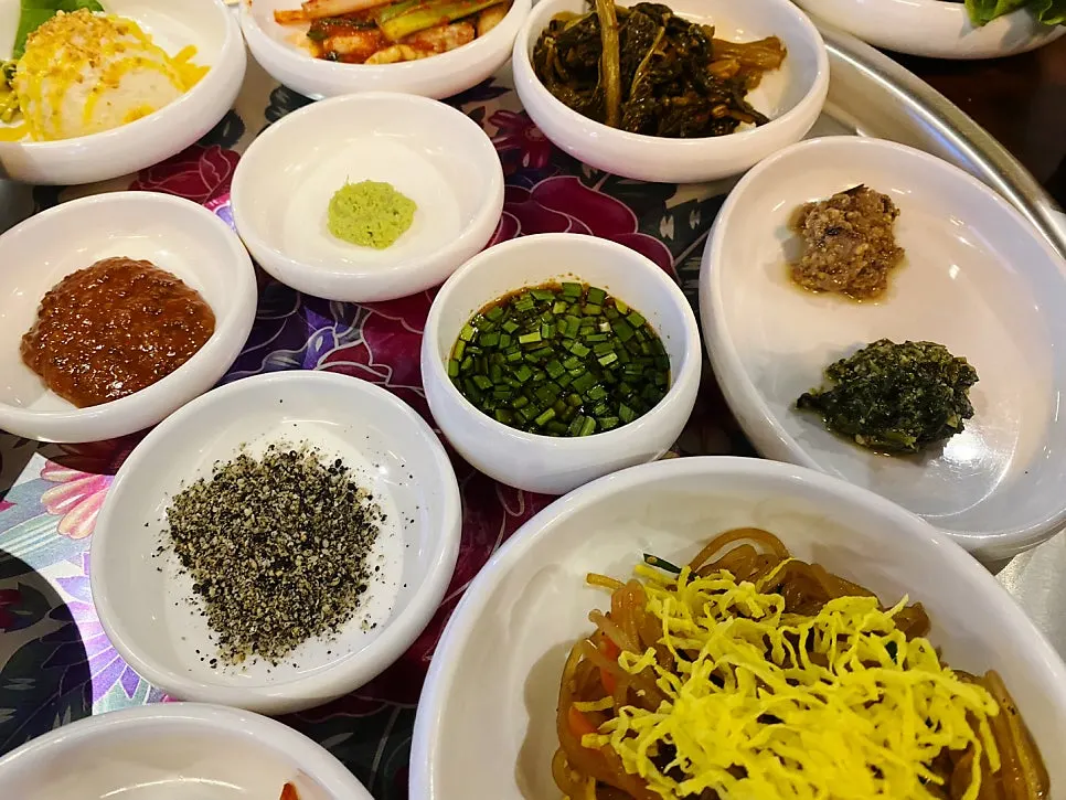 Various side dish plates on the table