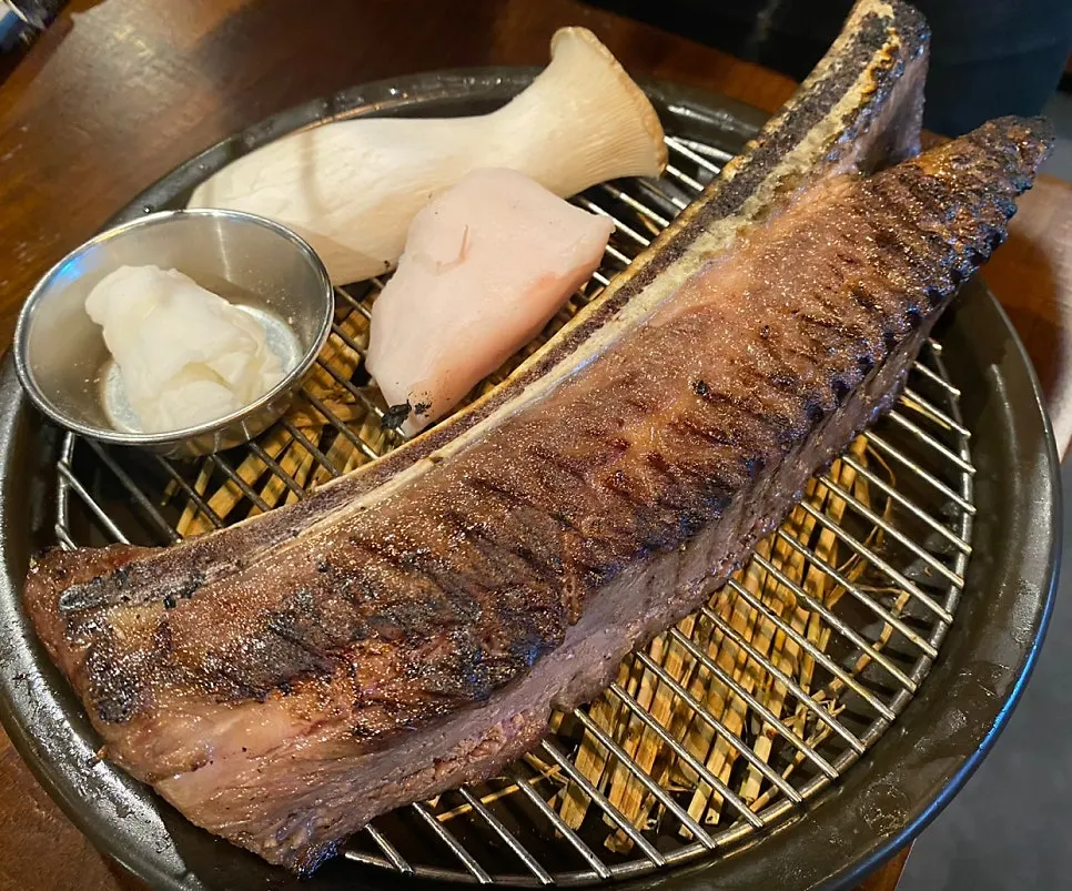 Thick raw prime rib served at Jipbul Taebaek