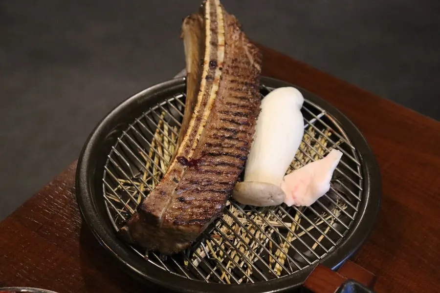 Marinated prime ribs placed on the grill
