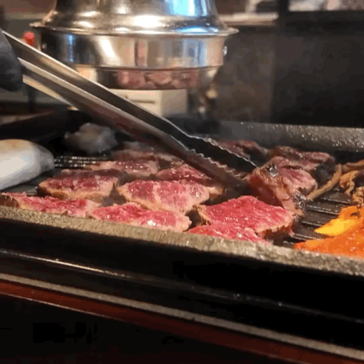Golden-brown seared surface of the grilled prime ribs