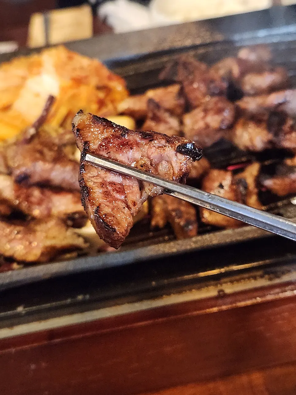 A piece of galbisal tasted plain, without sauce