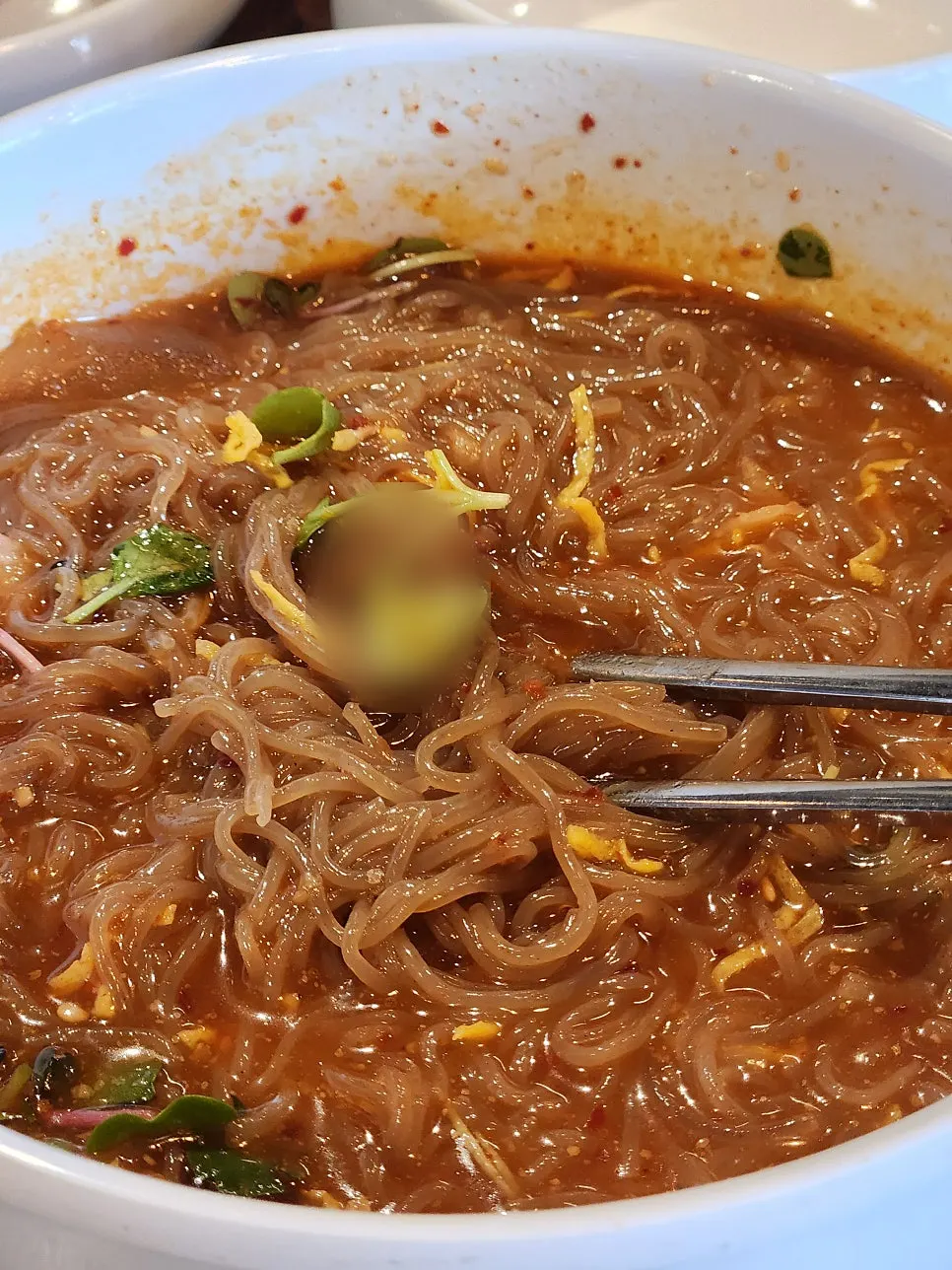 A bowl of the added buckwheat bibim naengmyeon