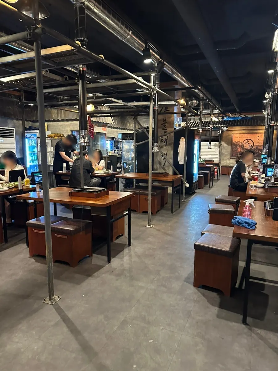 Dining hall divided into sections by hoods and pillars