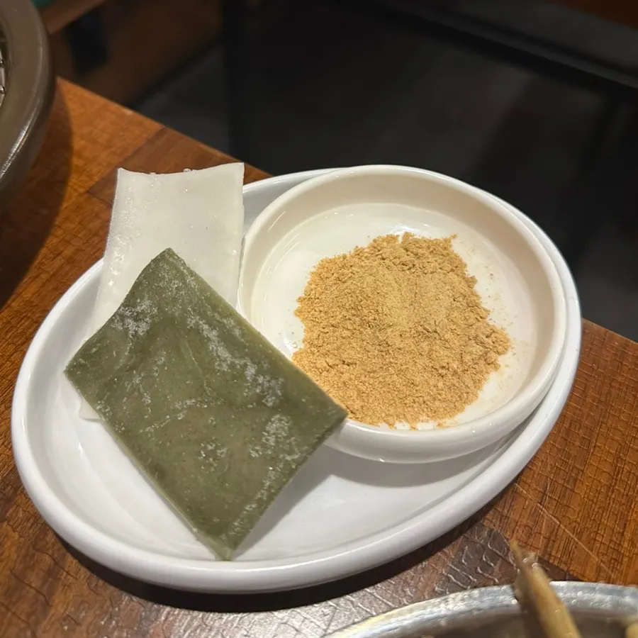 Tteok wraps and grilling kimchi for wrapping meat
