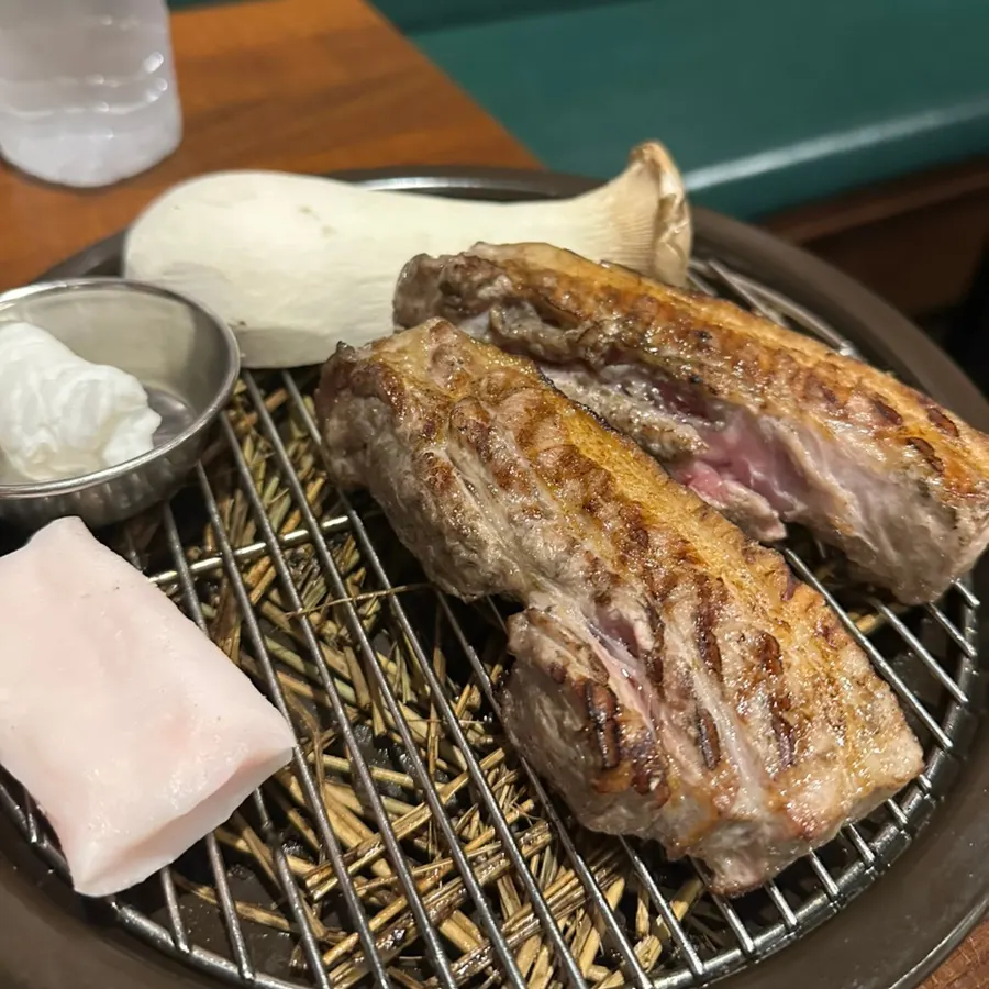 Plate of straw-fire pre-seared pork belly