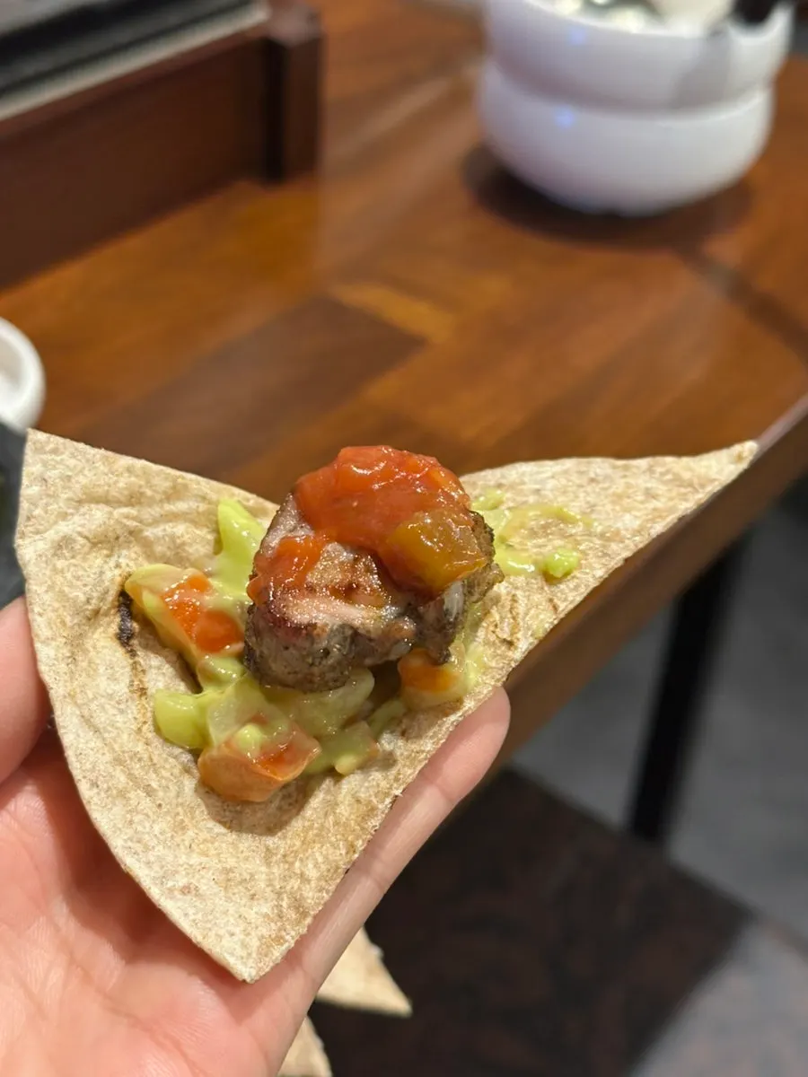 Finished tortilla topped with tomato sauce