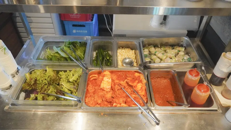 Self-bar with lettuce wraps and sauces at Jipbul Taebaek