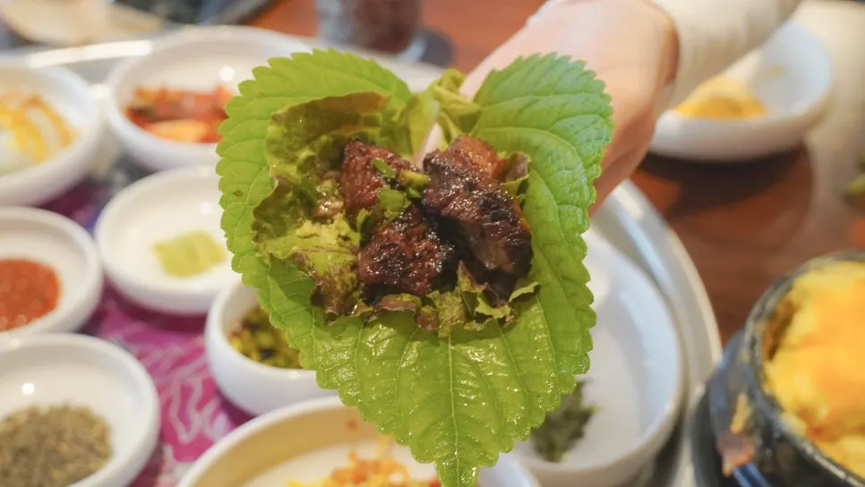 Meat wrapped in lettuce at Jipbul Taebaek