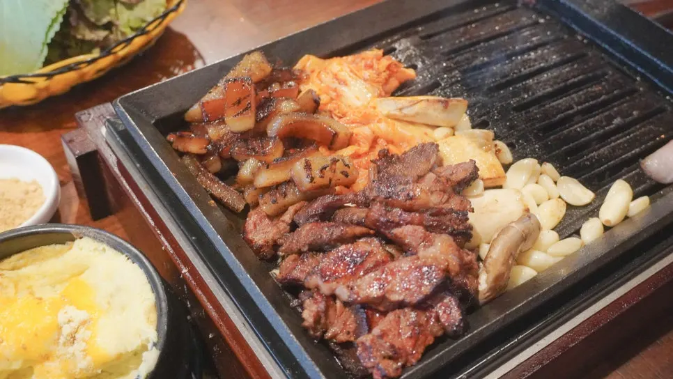 A piece of meat from Jipbul Taebaek dipped in sauce