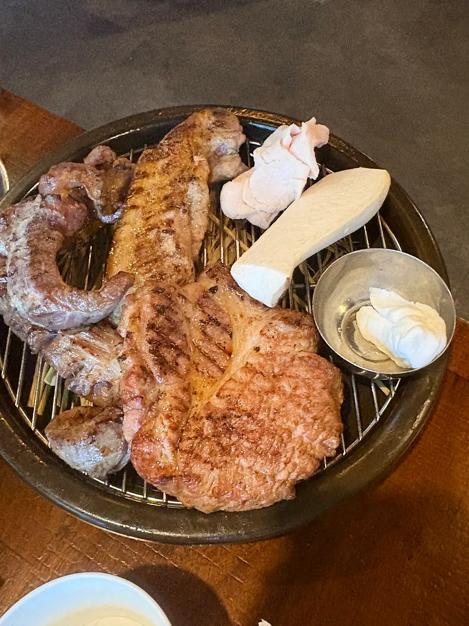 Meat plated with bracken fern and aged kimchi
