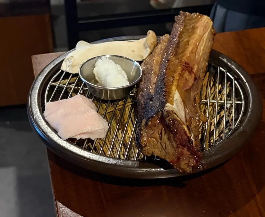 Prime ribs seared over a straw fire