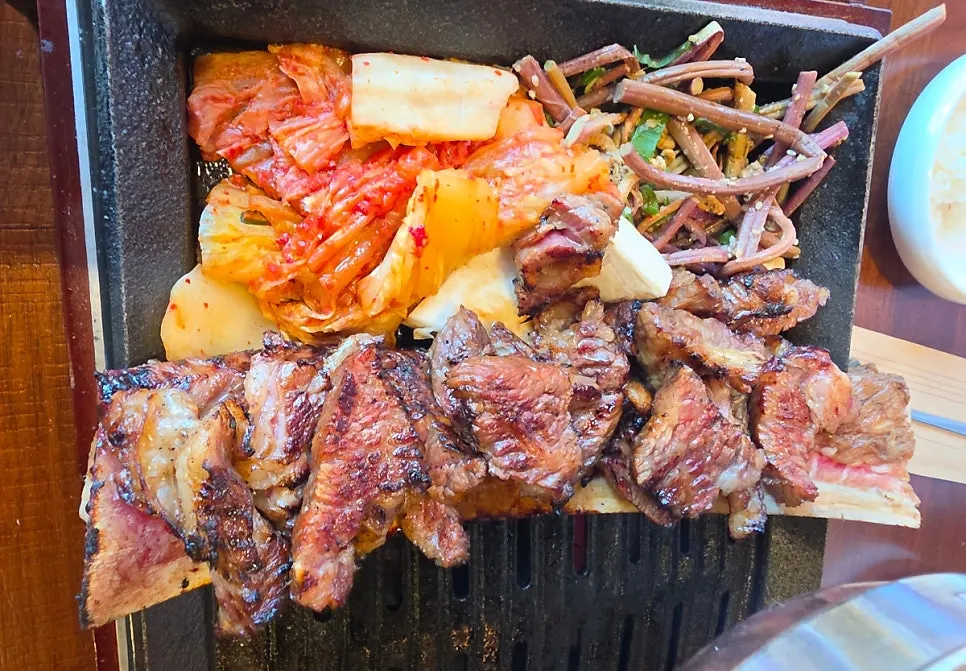Cooked prime rib placed on top of the rib bone