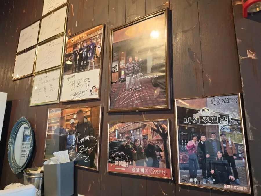 Autographed celebrity photos on the restaurant wall