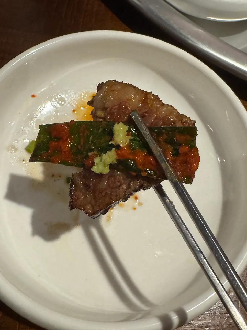 Rib meat dipped in soy sauce and topped with mushroom pesto