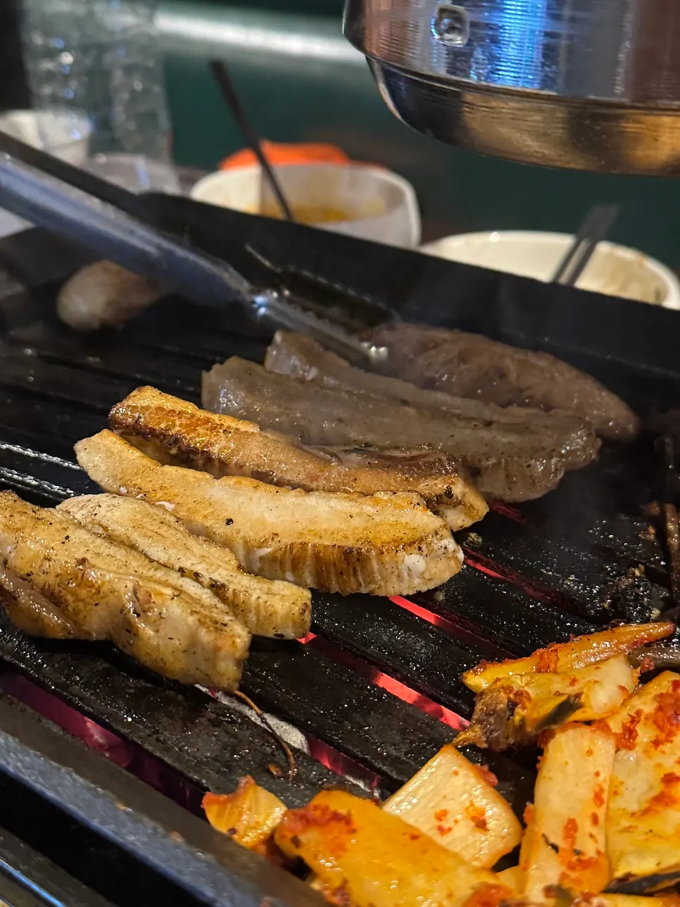 Staff grilling the pork jowl