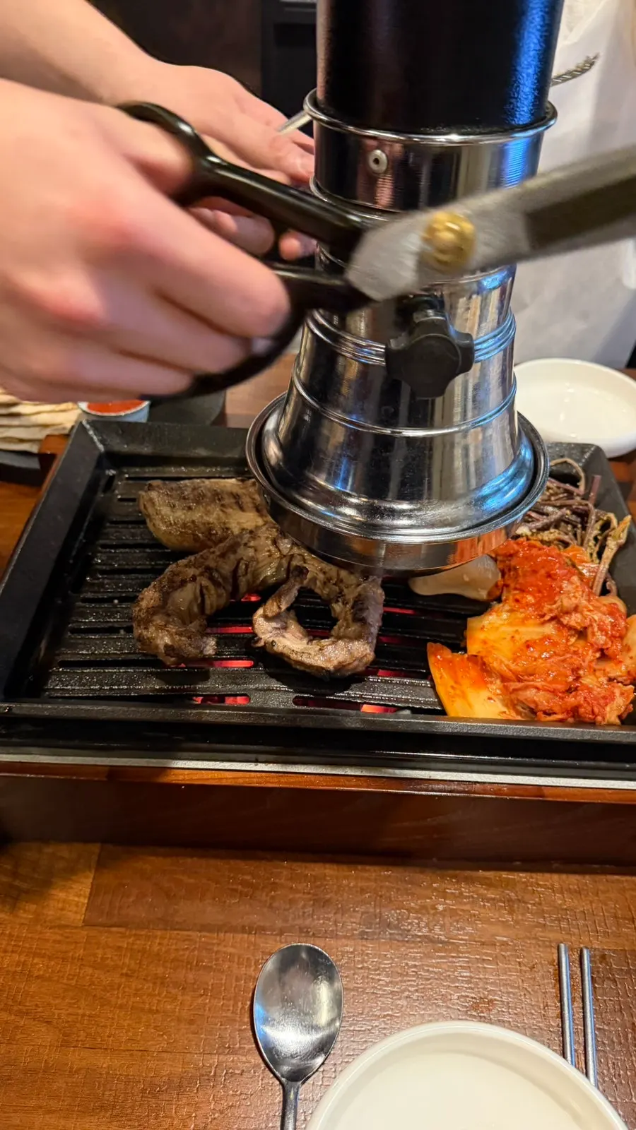 A piece of straw-fire grilled meat dipped in salt