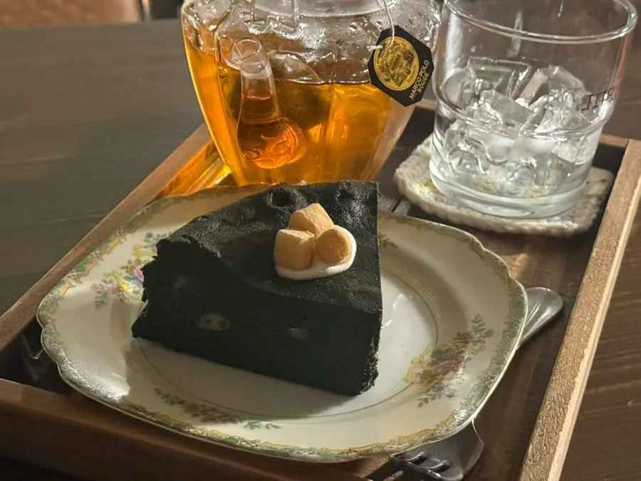 Table setting with terrine cake and iced Earl Grey tea