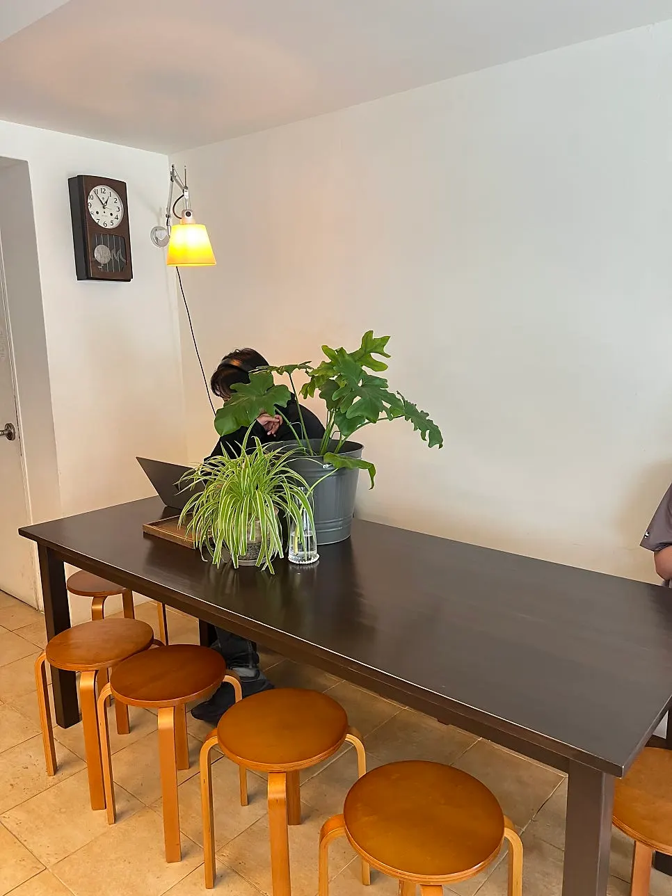 Work area with window seats and a large table