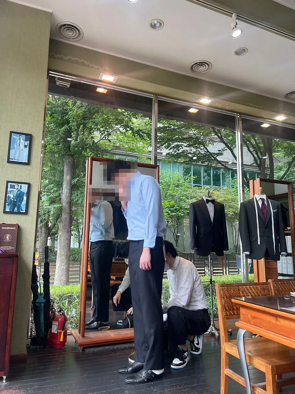Measuring waist and hip size during the custom suit fitting