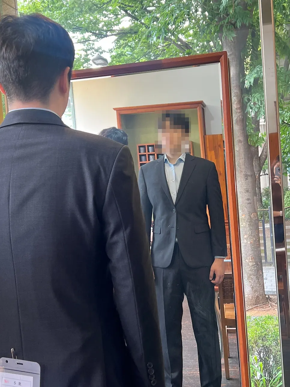 Measuring jacket length and mid-chest for the custom suit