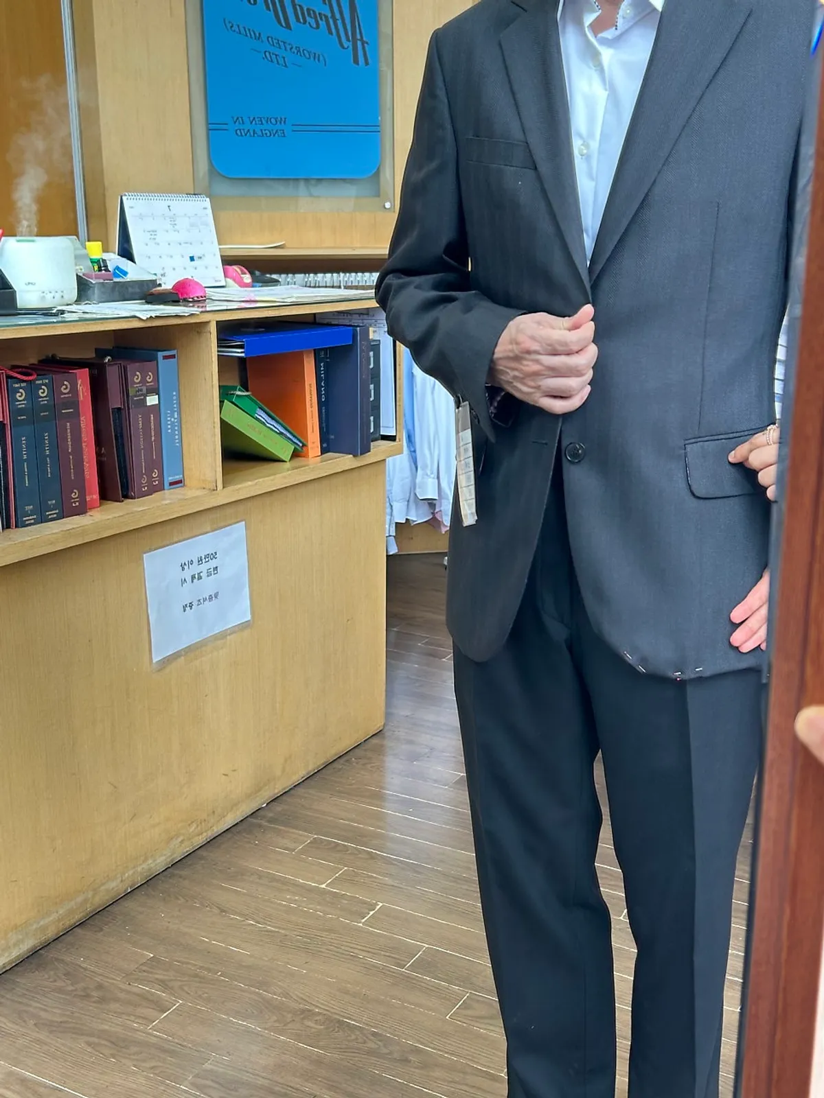 Checking the jacket length for the father-of-the-groom suit