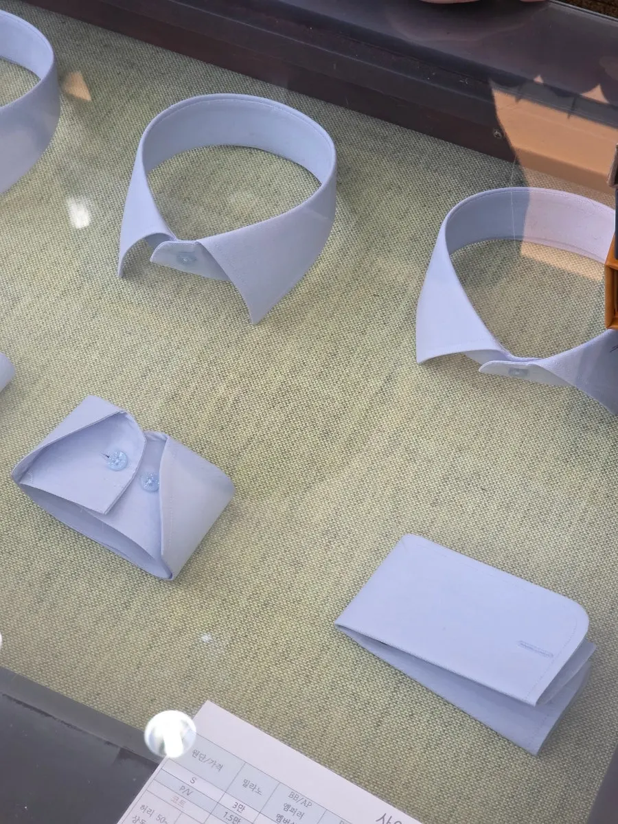 Inside the shop during a custom suit consultation