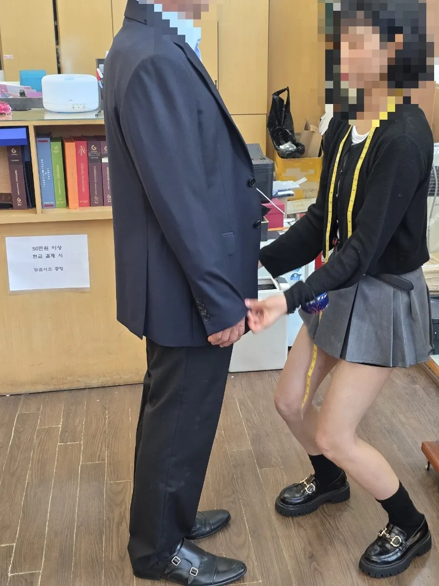 Taking jacket measurements with a tape measure
