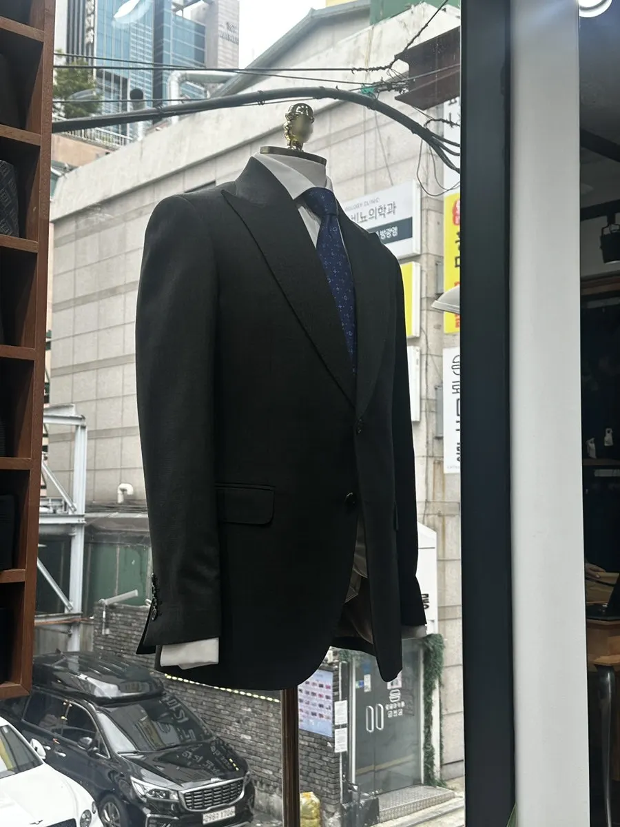 Suit jackets hanging near the store entrance