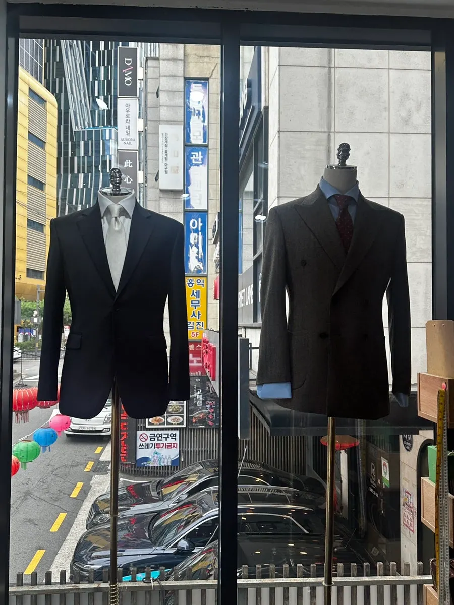 Store interior displaying check-pattern suits