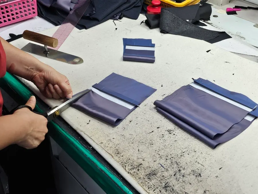 Sewing lining tape into a jacket on a machine