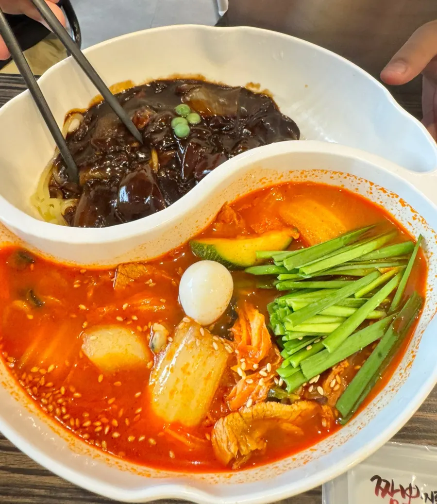 A bowl of jjamjjamyeon packed with ingredients