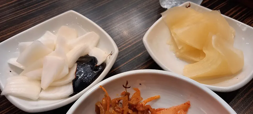 Rice and side dishes available at the self-serve bar