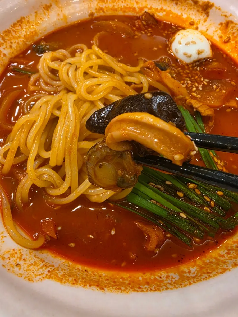 Scallops, squid, and wood ear mushrooms visible in the jjamppong