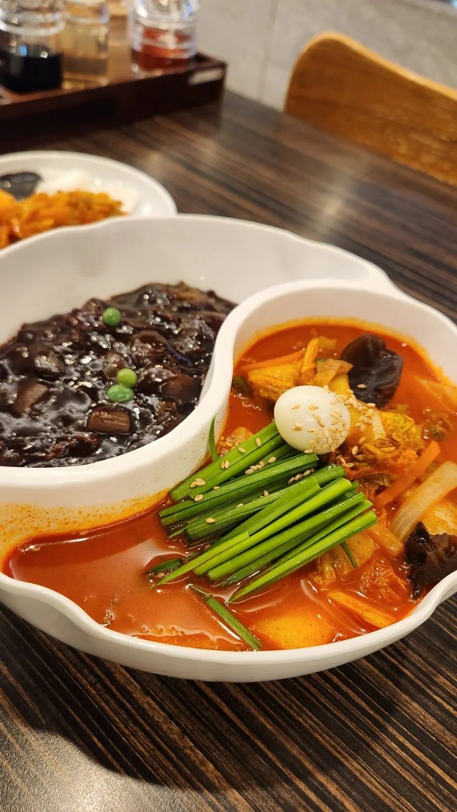 A bowl of jjamjjamyeon with both jjamppong and jjajang